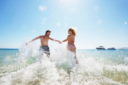 Couple having fun at sea on sunny holidays