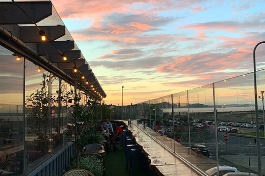 fika rooftop bar in bray at sunset