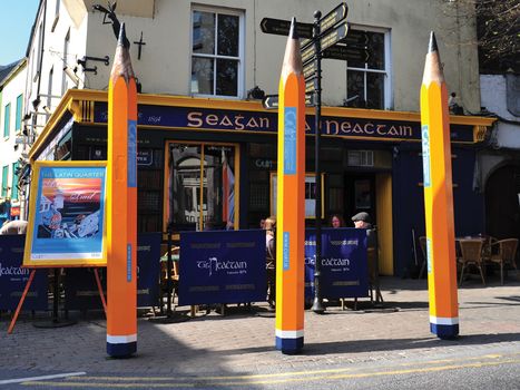 eight foot tall pencils outside Carroll's pub in Galway