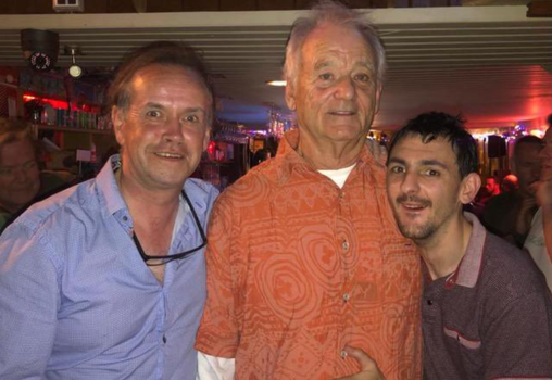 Bill Murray smiling for a photo in a Limerick pub