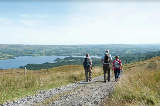 three people walking in the donegal countryside on a sunny day