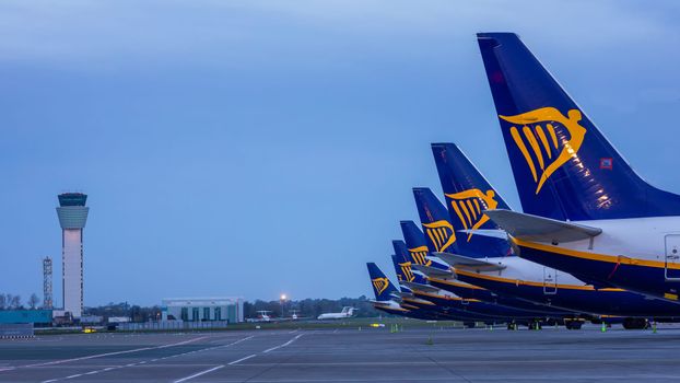 several ryanair planes parked beside each other in airport