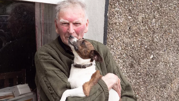 kim the jack russell in the arms of her owner, donal