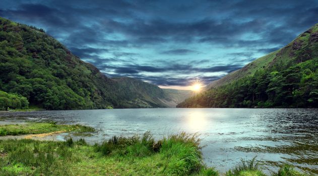 sunrise over a lake in wicklow