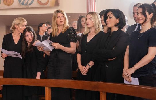 bad sisters cast dressed in black standing in line at a church pew