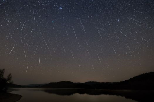 meteor shower with shooting stars in a night sky