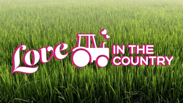 logo for Love in the Country with grass in the background