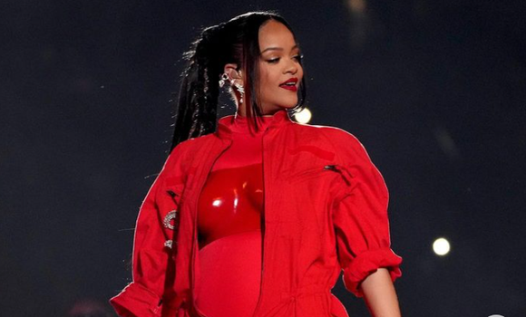 rihanna at the super bowl in a red jumpsuit