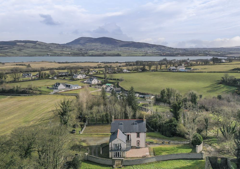 overhead shot of moress farm estate surrounded by trees and fields